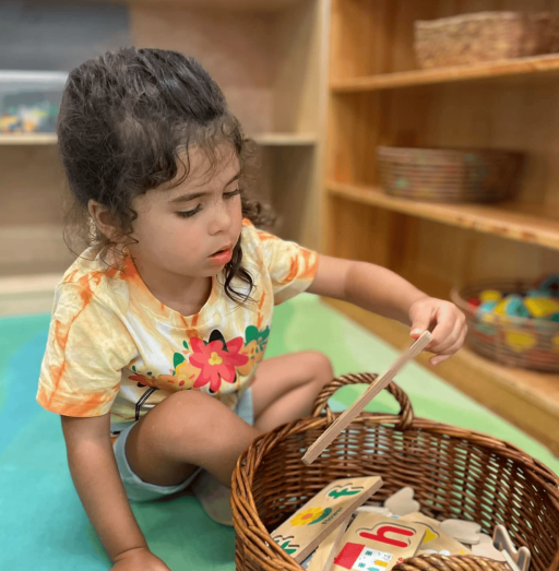 Young girl playing with puzzle